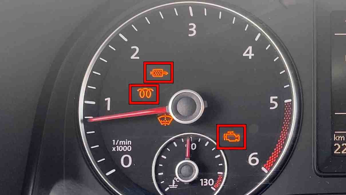 Volkswagen dashboard showing illuminated yellow EPC warning light with limp mode symbol, mechanic scanning car with diagnostic tool.