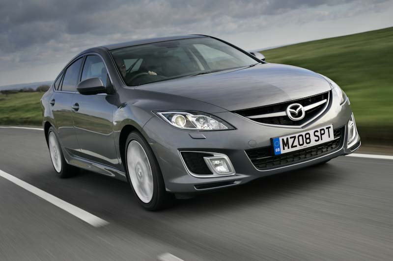 Mechanic diagnosing a Mazda 6 transmission whining noise caused by internal bearing failure, highlighting common problems and expensive repair costs.