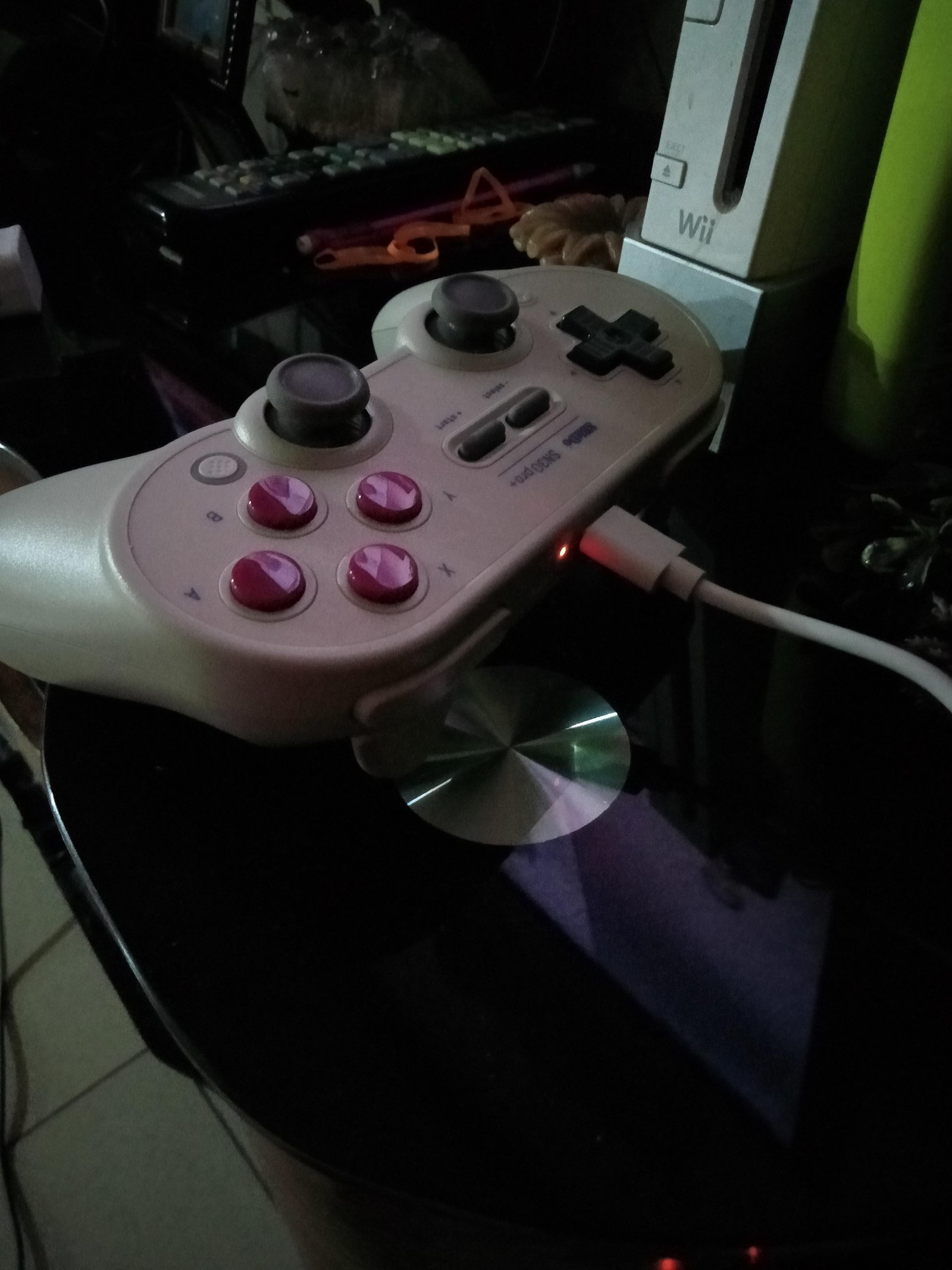 Connecting an 8BitDo Pro 2 controller to a laptop for a firmware update.