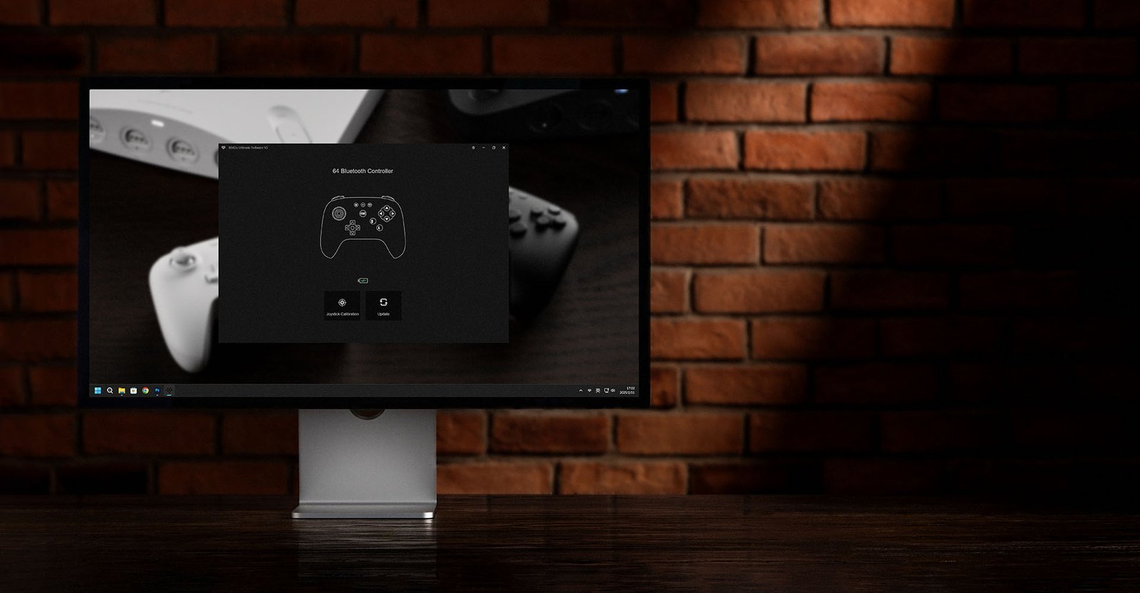 A gaming controller connected to a laptop via USB cable for 8bitdo software syncing.