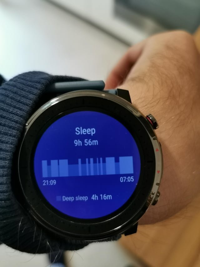 An organized desk space with an Amazfit Pace watch and tech accessories.