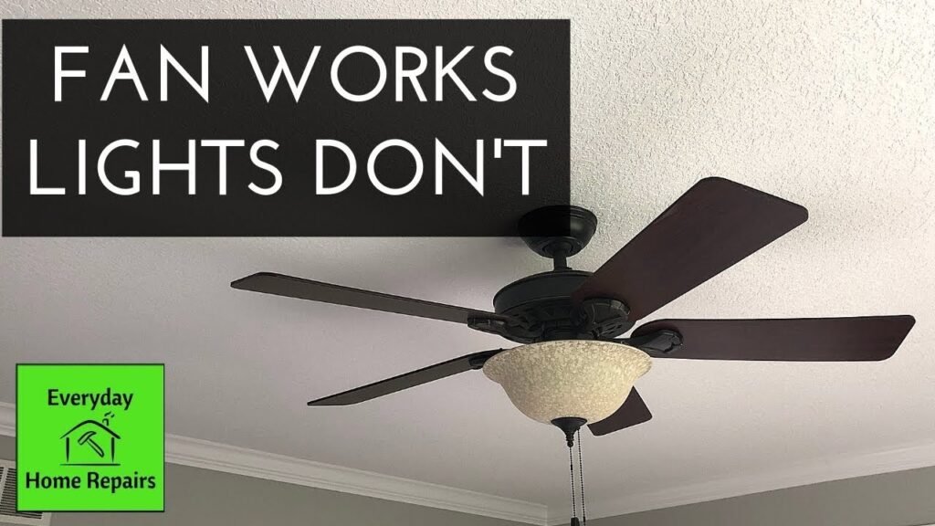 A modern ceiling fan light fixture hanging in a bright, clean living room.