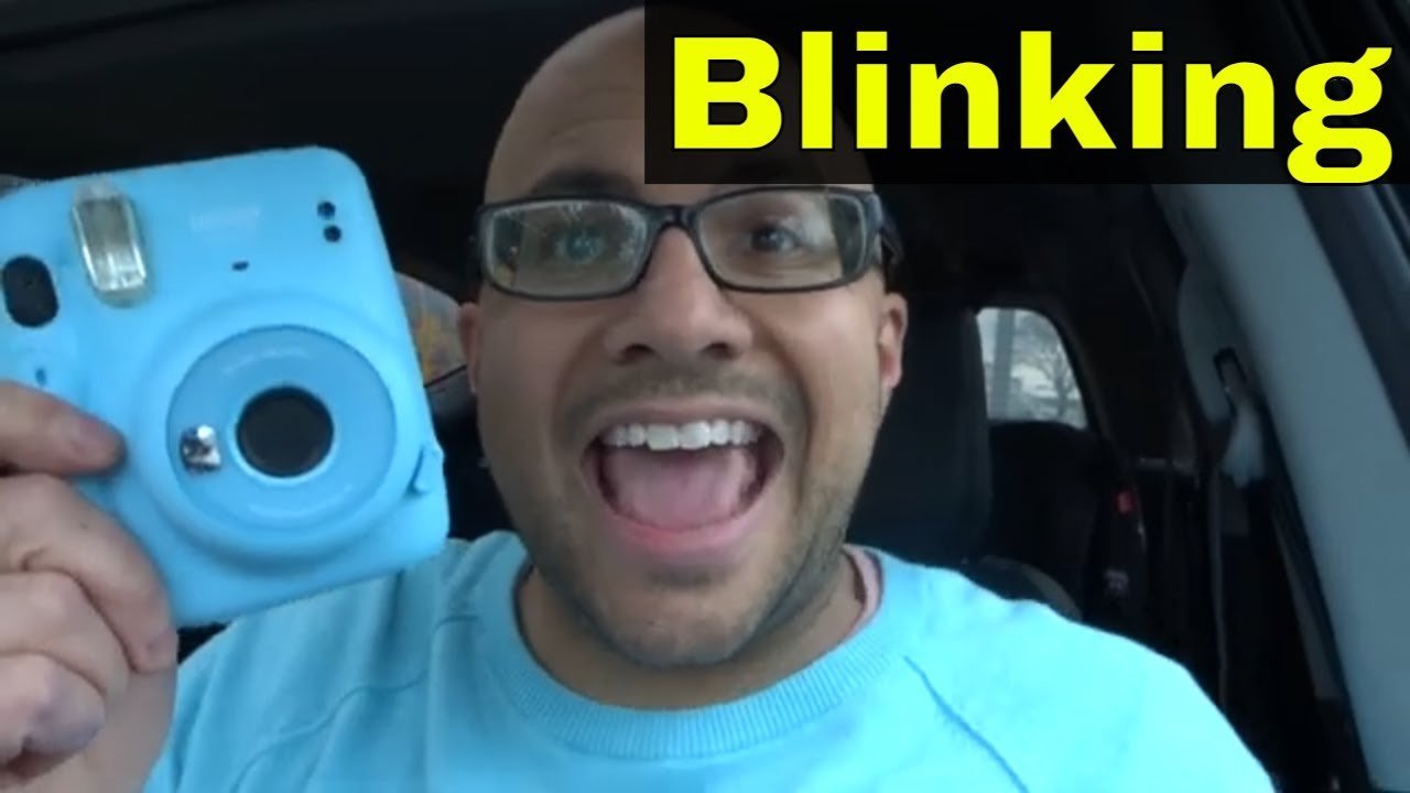 The blinking indicator light on an Instax Mini 11 camera during troubleshooting.