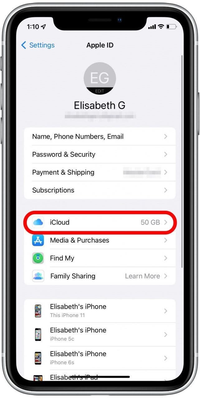 A person adjusting settings on an iPhone to fix calendar syncing issues.