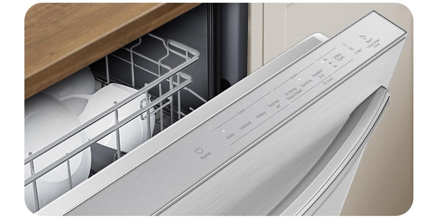 Detailed view of a dishwasher interior showing the drain hose and sensors.