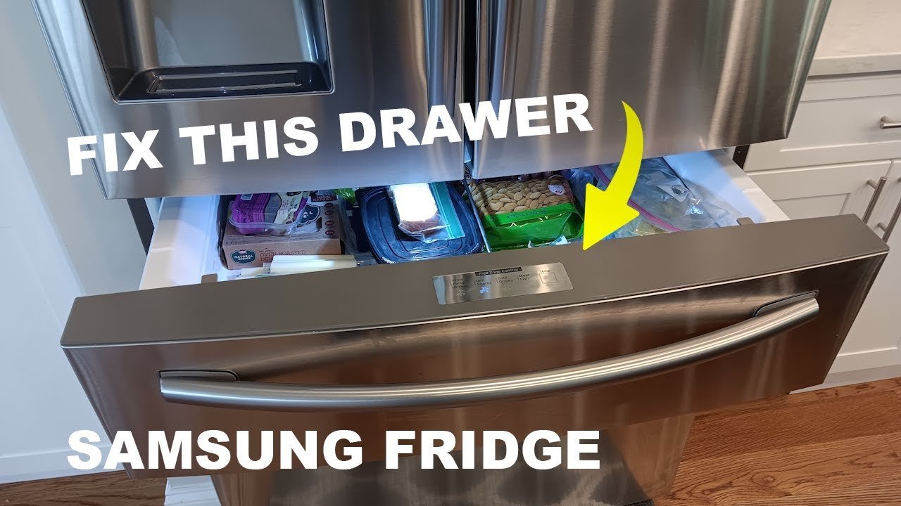 A close-up of a refrigerator door switch being tested by a finger.