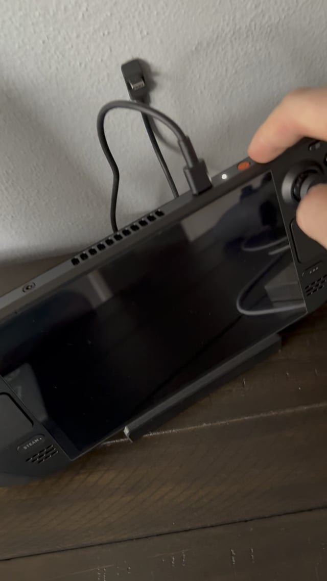 The Steam Deck power button flashes white during a hardware initialization error cycle.